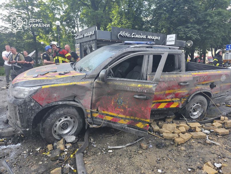 In this photo provided by the Ukrainian Emergency Service, an emergency vehicle damaged in Russia's missile attack is seen in the street in Kyiv, Ukraine, Friday, June 6, 2025