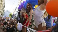 FILE. Drag queens dance on top of a truck during the Lisbon Gay Pride parade on Saturday, June 16, 2018, in Lisbon, Portugal.