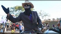 In Brazil, knights and masked riders take to a football pitch for religious festival
