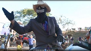 In Brazil, knights and masked riders take to a football pitch for religious festival