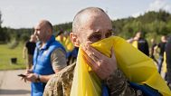 Ukrainian soldiers react after returning from captivity during a prisoners' exchange between Russia and Ukraine in Chernyhiv region, 10 June, 2025