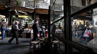 People walk through a market in Damascus, 15 December, 2022