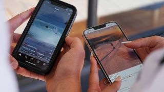 Two teenagers use their phones to access social media in Sydney, 8 November, 2024