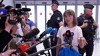 Activist Greta Thunberg answers reporters as she arrives from Israel at Charles de Gaulle airport, north of Paris, Tuesday, June 10, 2025