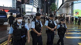 FILE: Police officers patrol in the Causeway Bay area on the eve of the 35th anniversary of China's Tiananmen Square crackdown in Hong Kong, June 3, 2024