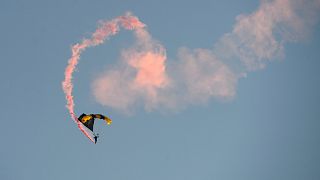 Members of the U.S. Army Parachute Team Golden Knights make their landing during the Army Birthday Twilight Tattoo event at Joint Base Myer-Henderson Hall, June 11, 2025.