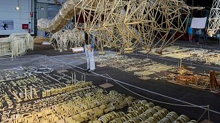 Dutch artist Theo Jansen's Beach Beasts, wind-powered creatures made from yellow plastic tubes, are displayed during an exhibit in Delft, Netherlands, Thursday, June 5, 2025.