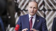 Ireland's Prime Minister Michael Martin talks to journalists as he arrives for an EU summit in Brussels. 21 October 2021.