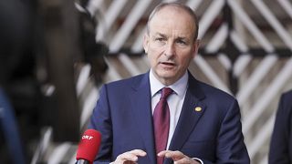 Ireland's Prime Minister Michael Martin talks to journalists as he arrives for an EU summit in Brussels. 21 October 2021.