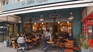 People sit at the renovated"La Belle Equipe"cafe in Paris, France. 21 March 2026.