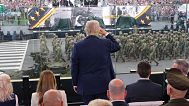 President Donald Trump salutes passing troops during a parade to honor the Army's 250th anniversary, coinciding with Trump's 79th birthday, Saturday, June 14, 2025.