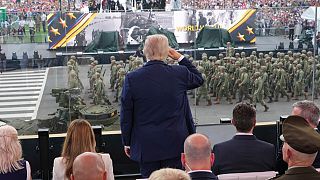 President Donald Trump salutes passing troops during a parade to honor the Army's 250th anniversary, coinciding with Trump's 79th birthday, Saturday, June 14, 2025.