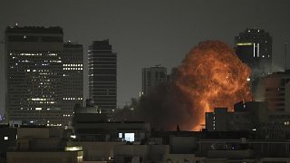 An explosion is seen during a missile attack in Tel Aviv, Israel, Sunday, June 15, 2025.