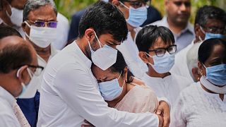 Air India crash victims mourn during a wreath-laying ceremony outside a hospital in Ahmedabad, India, on June 16, 2025.