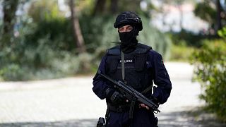 A police officer stands in Lisbon, 28 March, 2023