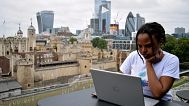 Woman on a laptop in London.