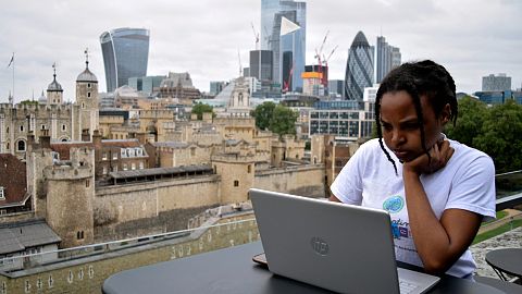 Woman on a laptop in London.
