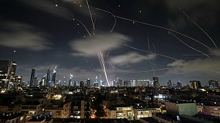 The Israeli Iron Dome air defense system fires to intercept missiles during an Iranian attack over Tel Aviv, Israel, early Wednesday, June 18, 2025