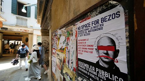 Posters by the ‘No Space for Bezos’ group in Venice.