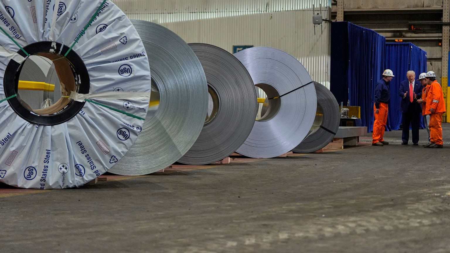 President Donald Trump talks to workers as he tours U.S. Steel Corporation's Mon Valley Works-Irvin plant. West Mifflin. 30 May 2025.