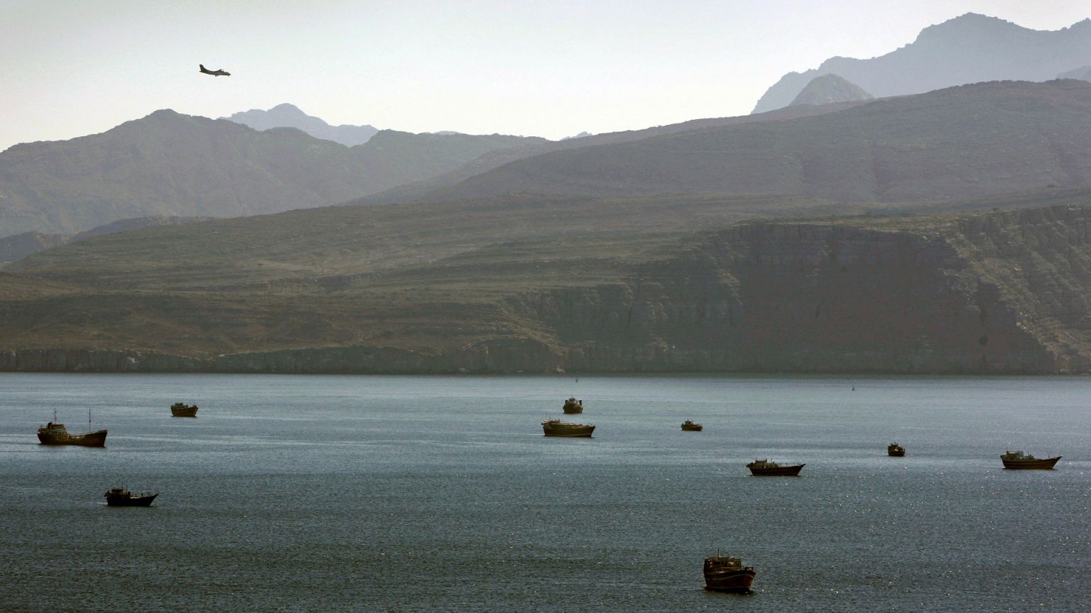 A plane flies over the mountains in south of the Strait of Hormuz. For illustrative purposes only.