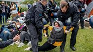A woman is carried away by police officers during a pro-Palestinians demonstration by the group "Student Coalition Berlin" . 