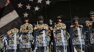 National Guard soldiers are posted near an entrance to the Federal Building in Los Angeles.