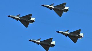 J-10 jet fighters perform in formation to celebrate the 60th anniversary of the People's Liberation Army Air Force in Beijing, China, 15 November 2009.