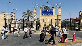 Foreign residents evacuated from Israel after missile strikes, cross Taba Land Port, a border crossing on the eastern border with Israel, to Egypt, Thursday, June 19, 2025.