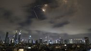 Israeli air defense system fires to intercept missiles during an Iranian attack over Tel Aviv, Israel, Saturday, June 21, 2025
