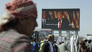 Houthi supporters chant slogans during a weekly anti-US and anti-Israel rally under a banner criticising President Donald Trump in Sanaa, Yemen, Friday, 16 May 2025