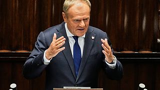 Poland's Prime Minister Donald Tusk addresses the Polish parliament on Wednesday, June 11, 2025, in Warsaw, Poland