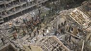 Firefighters, rescue workers and military work at the site of a direct missile strike launched from Iran in Tel Aviv, Israel, on Sunday, June 22, 2025.