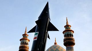 FILE: A model of a missile is carried by Iranian demonstrators during an anti-Israeli gathering in Tehran, 15 April 2024