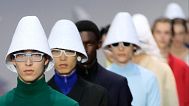 Models wear creations as part of the men's Prada Spring-Summer 2026 collection, that was presented in Milan, Italy, Sunday, 22 June 2025
