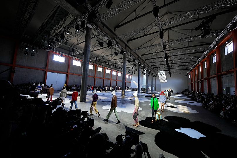 Models wear creations as part of the men's Prada Spring-Summer 2026 collection.