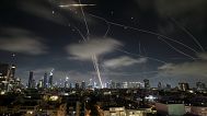 The Israeli Iron Dome air defense system fires to intercept missiles during an Iranian attack over Tel Aviv