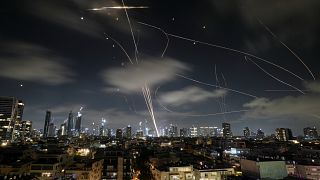 The Israeli Iron Dome air defense system fires to intercept missiles during an Iranian attack over Tel Aviv