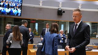 Hungary's Foreign Minister Peter Szijjarto, right, arrives for a round table meeting of EU foreign ministers at the European Council building in Brussels, Monday, June 23, 202