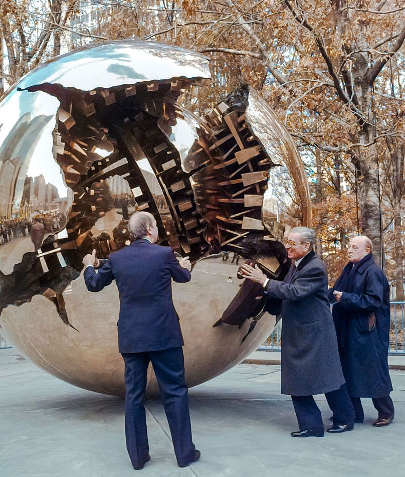 Arnaldo Pomodoro, right, with Italy's Foreign Minister Umberto Dini and Boutros Boutros-Ghali, center, at unveiling at the United Nations - 1996