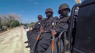 Rwandan policemen patrol near the Amarula Palma hotel in Cabo Delgado province, 15 August, 2021