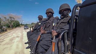 Rwandan policemen patrol near the Amarula Palma hotel in Cabo Delgado province, 15 August, 2021
