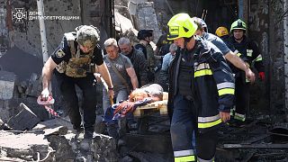 Rescuers carry an injured civilian following Russia's missile attack in Dnipro, 24 June, 2025