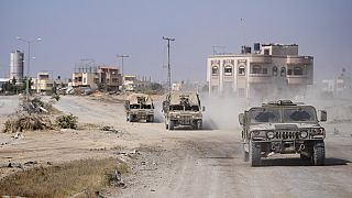 ARCHIVE Israeli army vehicles transport a group of soldiers and journalists inside the southern Gaza Strip, Sunday, June 8, 2025. 