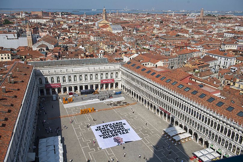 Photo released by Greenpeace showing a large banner against Jeff Bezos' planned wedding, in St. Mark Square, in Venice - 23 June 2025