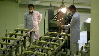 FILE: Iranian technicians work at a new facility producing uranium fuel for a planned heavy-water nuclear reactor, just outside the city of Isfahan, 9 April 2009