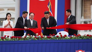 North Korean leader Kim Jong Un cuts the inaugural tape during a completion ceremony of the Wonsan-Kalma coastal tourist zone in North Korea.