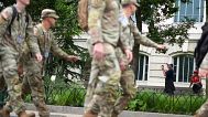 U.S. Army soliders walking along Constitution Ave., on the National Mall ahead of a parade commemorating the Army's 250th anniversary