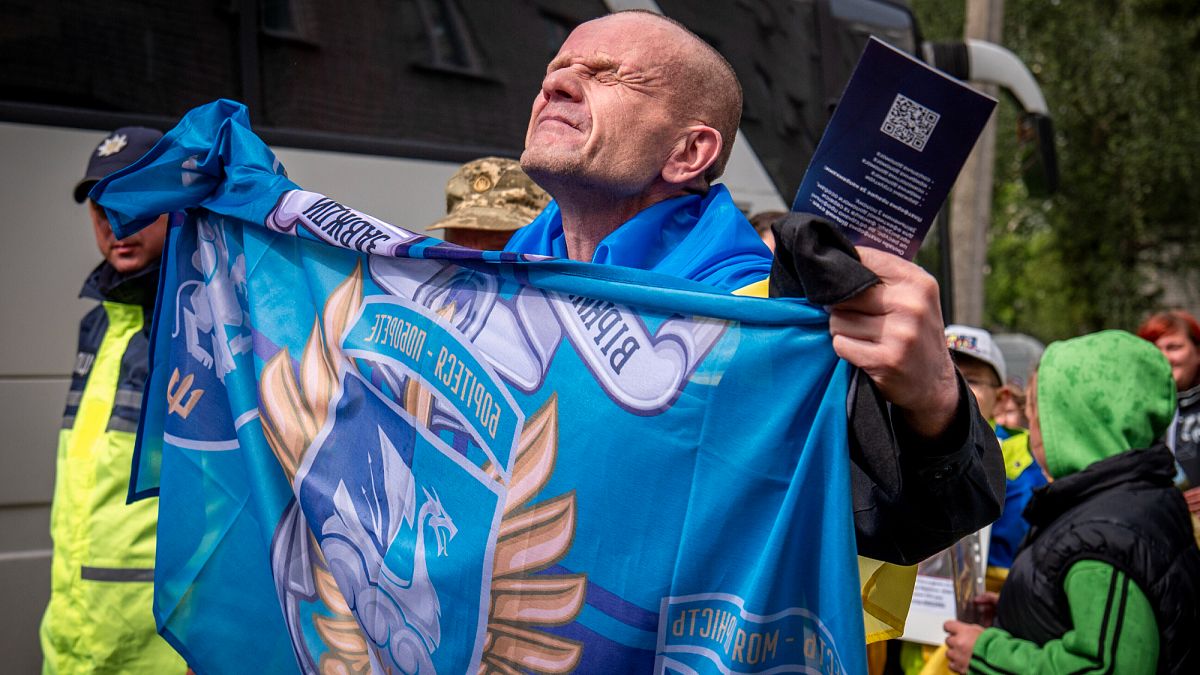 Watch: Emotional homecoming for POWs freed by Russia