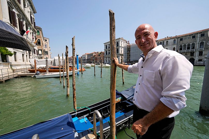 A lookalike of Jeff Bezos poses for photos 